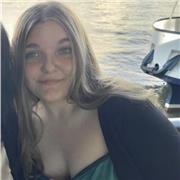 Maths tutor providing help to all children